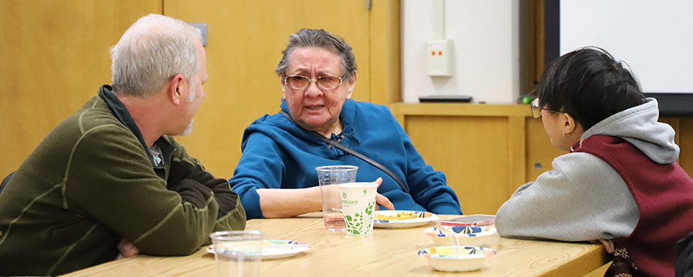 Val Barber enjoying lunch with a student and UW staff, Peter Haney