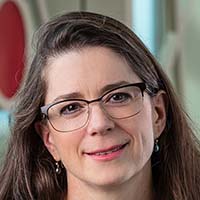 HEADSHOT OF SMILING WOMAN
